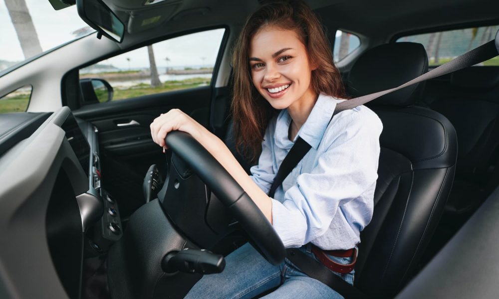 driver-woman-car-steering-wheel-smile-a-woman-1.jpg